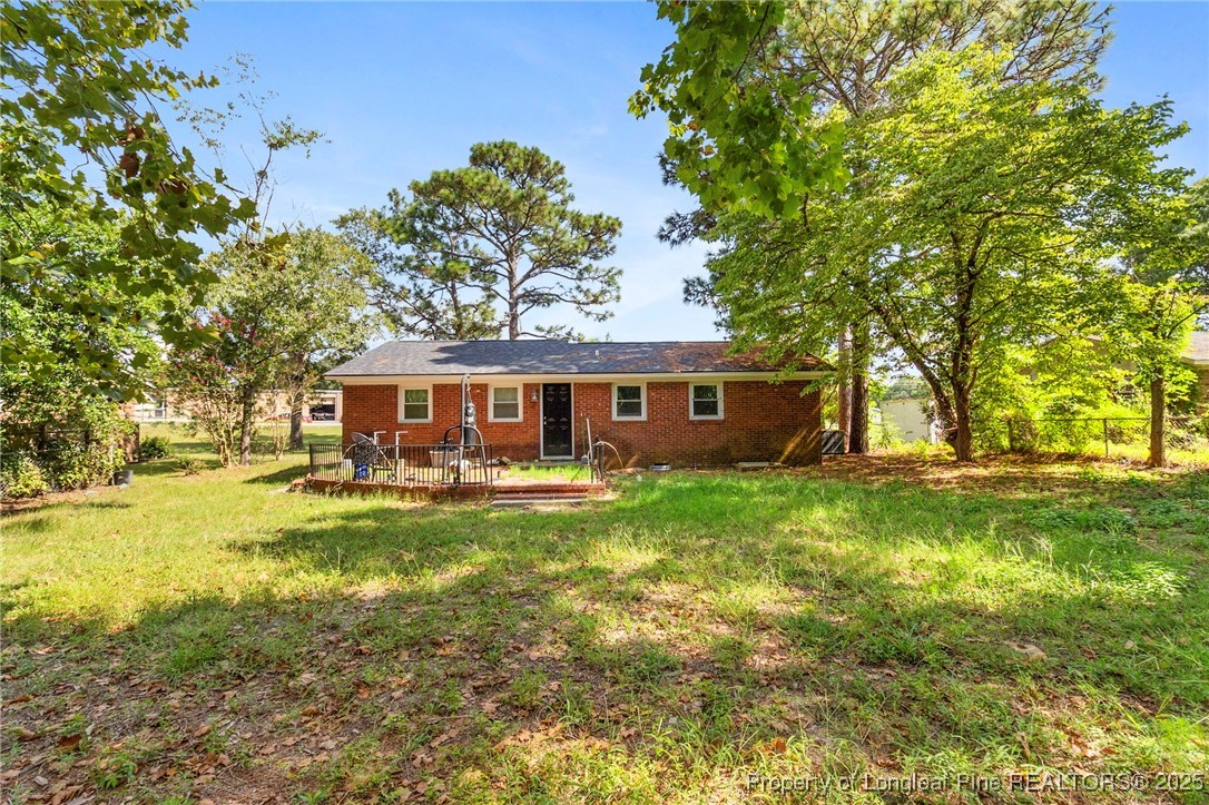 4112 Legion Road Hope Mills, NC 28348 - Photo 21 of 22 a view of a yard in front of the house