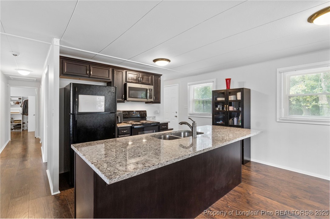 4112 Legion Road Hope Mills, NC 28348 - Photo 9 of 22 a kitchen with sink cabinets and refrigerator