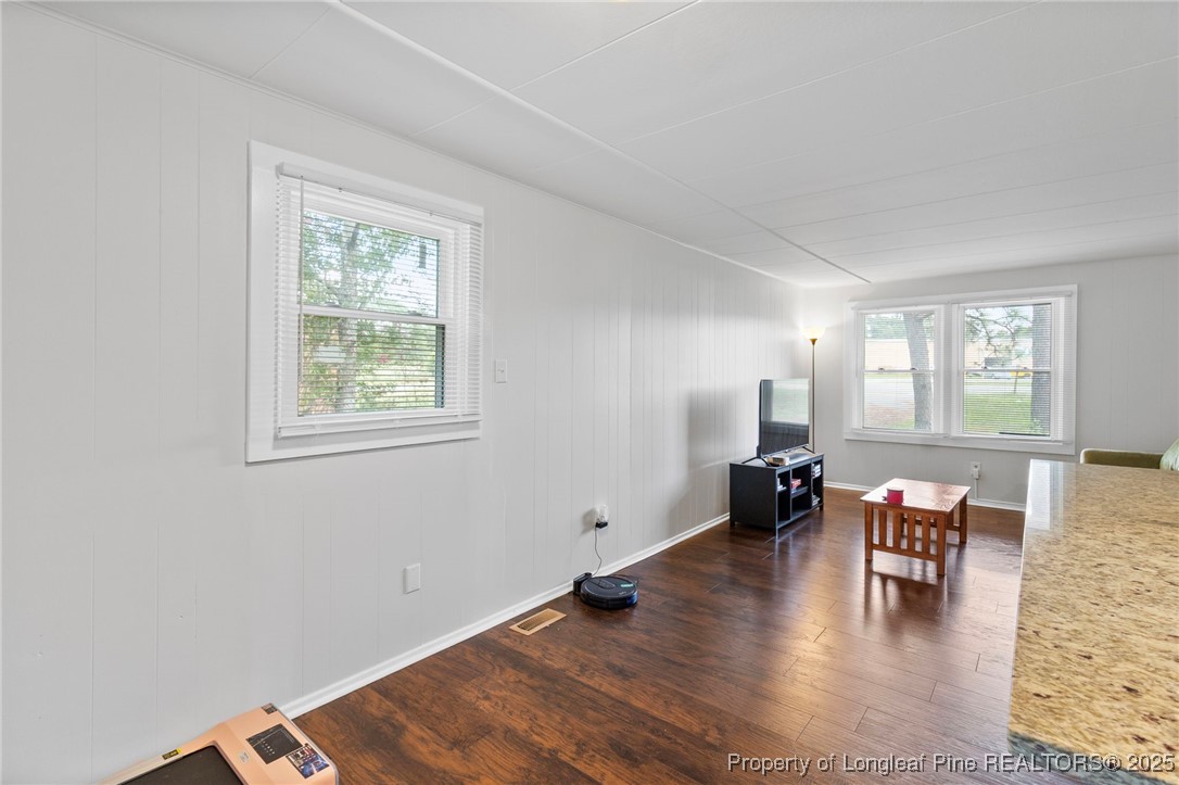 4112 Legion Road Hope Mills, NC 28348 - Photo 10 of 22 a living room with furniture and wooden floor next to a window
