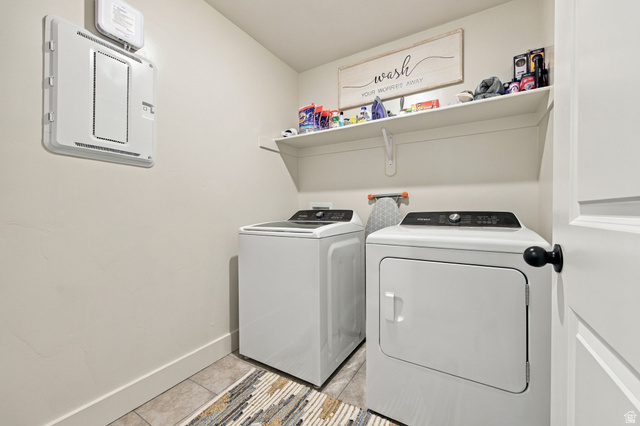 1566 Silver Canoe Loop Logan, UT 84321 - Photo 35 of 44 Laundry area featuring a wall-mounted shelf, light-toned walls, and tile flooring