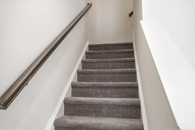 a close view of a utility room with dryer and washer