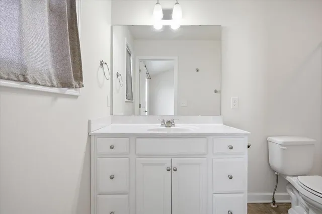 a bathroom with a shower and toilet