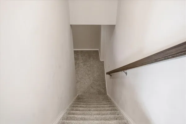 an empty room with a ceiling fan and hardwood floor