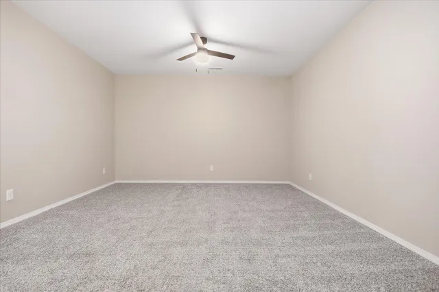 a bathroom with a shower and a toilet