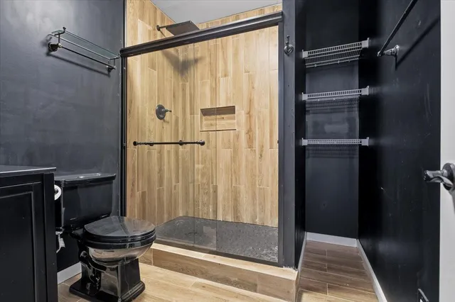 a view of a house with a chairs in patio