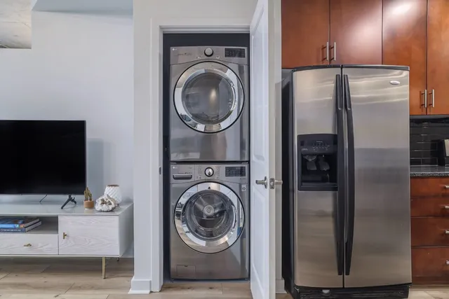 a living room with a flat screen tv and a fireplace