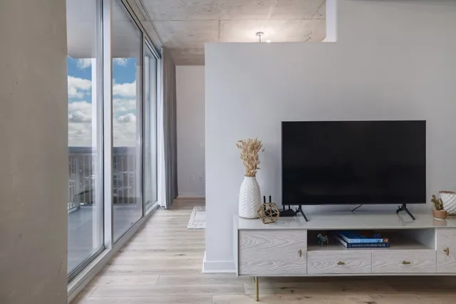 a bedroom with a large bed and a couch