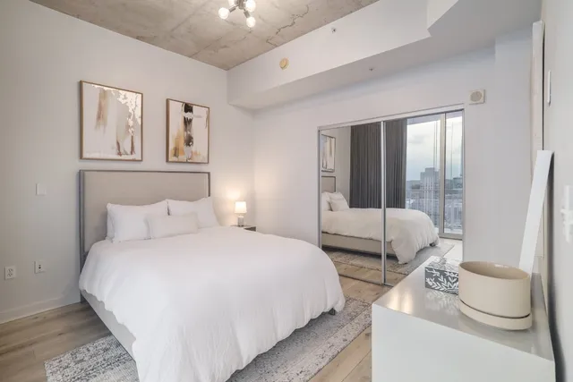 a view of a large window with the view of bedroom