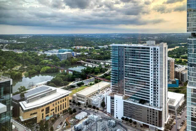 a view of a balcony with floor to ceiling window wooden floor