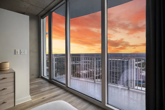 a view of bedroom with a large window
