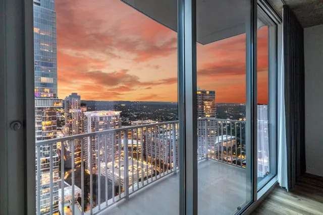 a view of a swimming pool with chairs