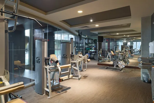 a lobby with furniture and a rug