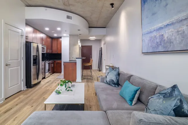a kitchen with stainless steel appliances a refrigerator and a stove top oven