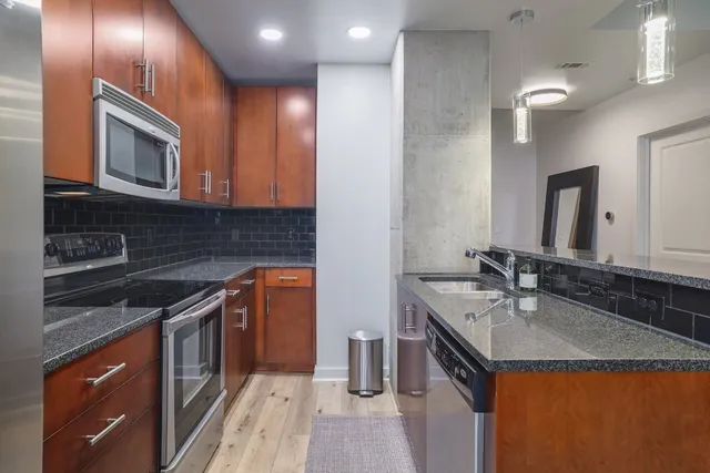 a view of a livingroom with washer and dryer