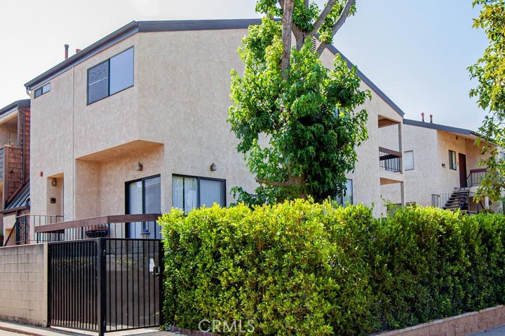 a view of a house with a flower garden