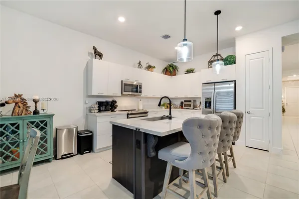 a view of a room with furniture and a window