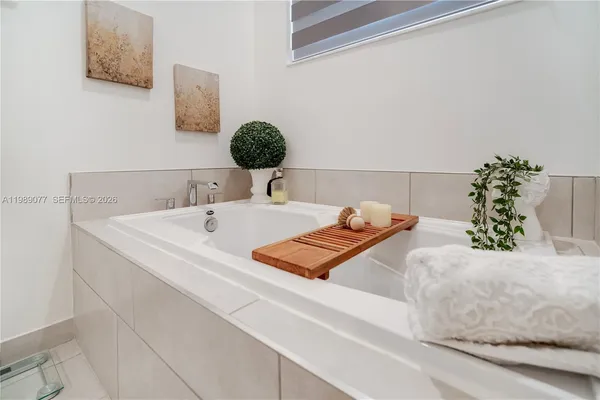 a bathroom with a shower toilet and sink
