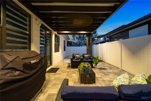 a outdoor living space with furniture and a potted plant