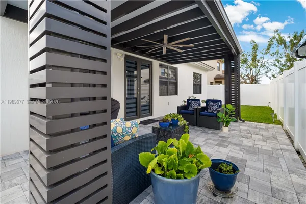 an aerial view of a house with a garden and swimming pool