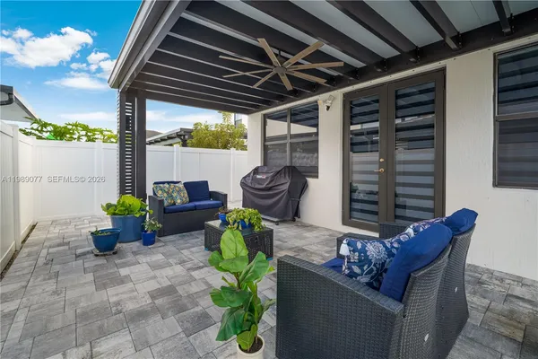 an aerial view of residential houses with outdoor space and swimming pool