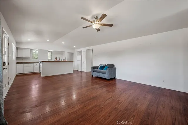 a view of kitchen and hall with wooden floor