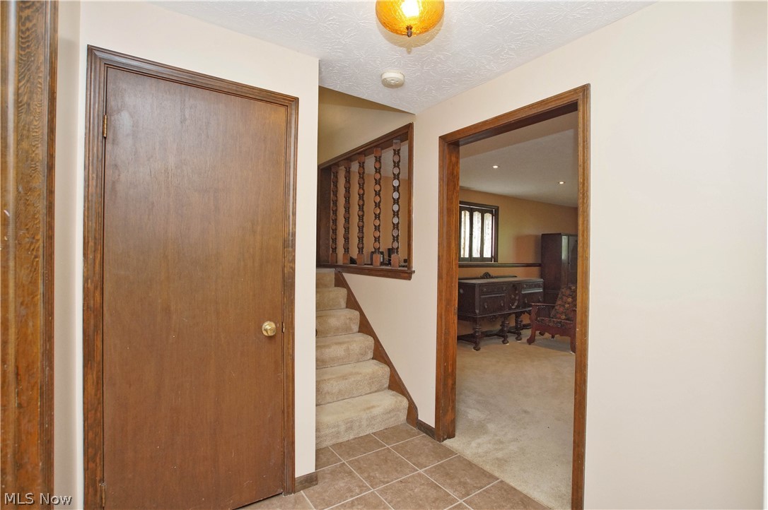 4009 Dayton Road Madison, OH 44057 - Photo 19 of 32 Lower level landing looking into the Family Rm.