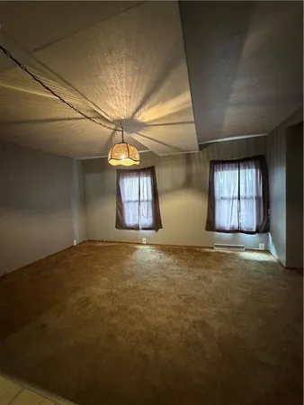a view of empty room with windows