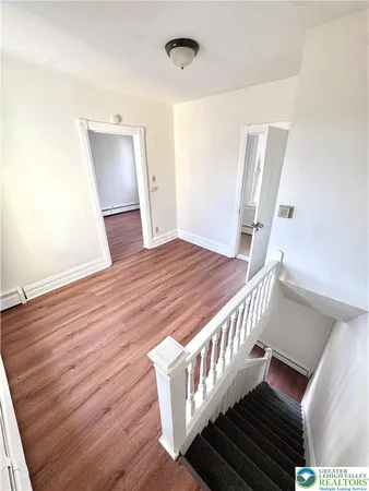 a stairs of a house with wooden floor