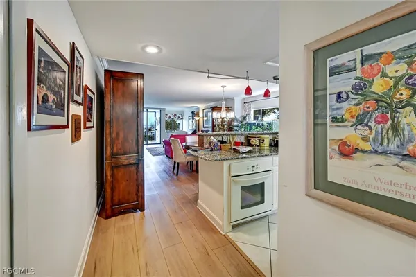 a kitchen with stainless steel appliances granite countertop a refrigerator and stove top oven