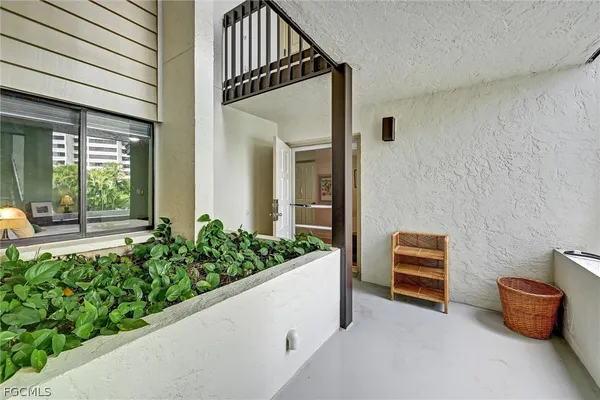 a view of room with balcony and outdoor space