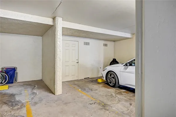 a view of a room with a sink and a mirror