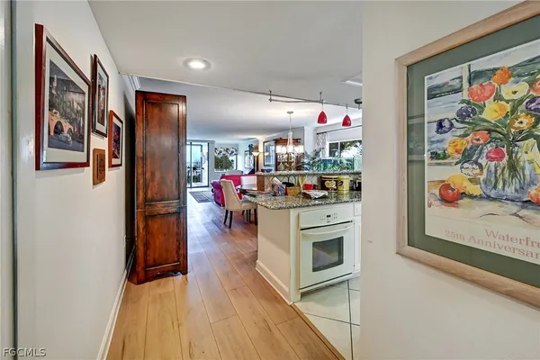 a kitchen with stainless steel appliances granite countertop a refrigerator and stove top oven