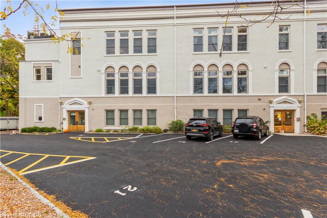 a view of a car park in front of a building