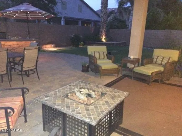 swimming pool view with a seating space