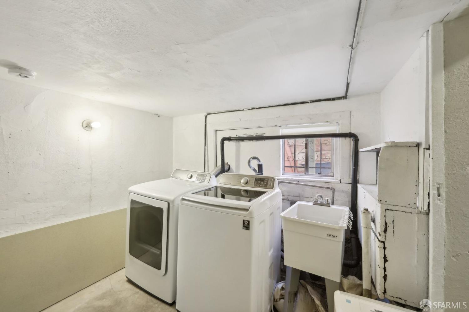2047 36th Avenue Oakland, CA 94601 - Photo 9 of 19 a utility room with dryer and washer