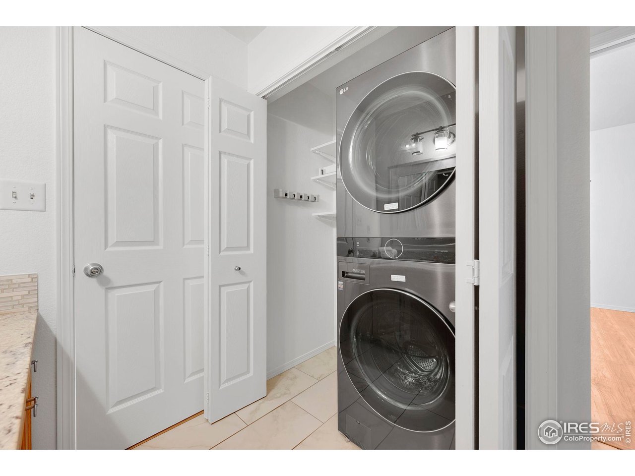 3109 Concord Way Longmont, CO 80503 - Photo 19 of 50 Laundry closet on main level with 2021 LG front load washer/dryer. An additional W/D is in the basement