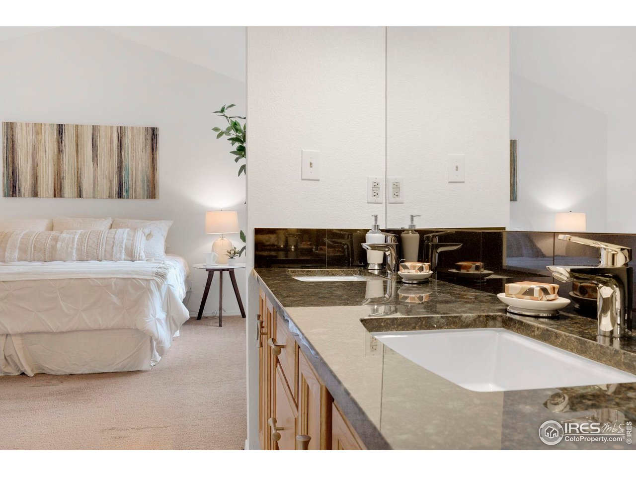 3109 Concord Way Longmont, CO 80503 - Photo 25 of 50 The primary is very private with lofted ceilings and a double sink bathroom