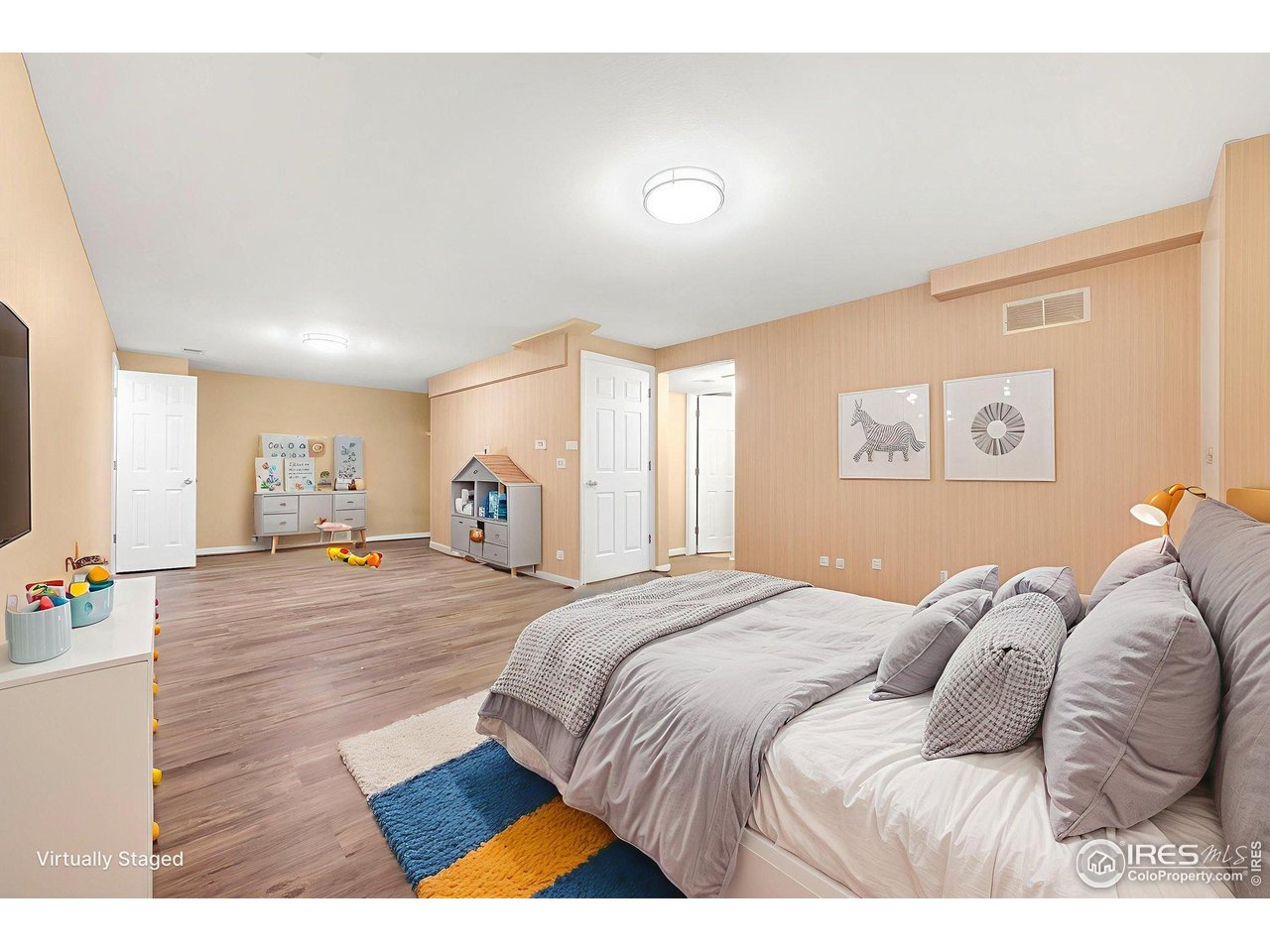 3109 Concord Way Longmont, CO 80503 - Photo 36 of 50 Basement virutally staged as a bedroom/playroom. There is a designated bedroom down here as well