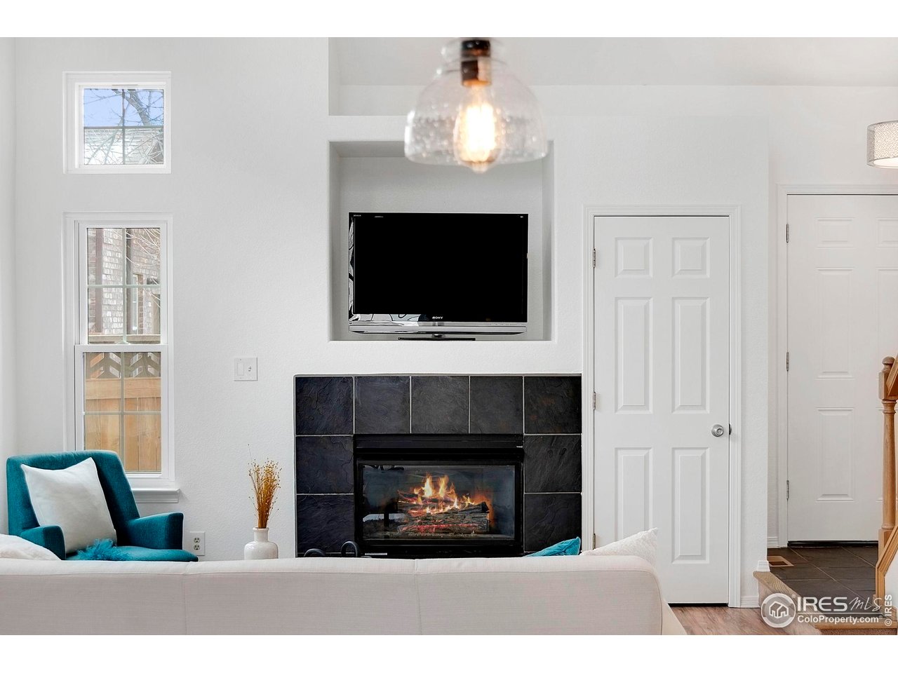 3109 Concord Way Longmont, CO 80503 - Photo 9 of 50 Gas fireplace in the living room and a coat closet at the entry