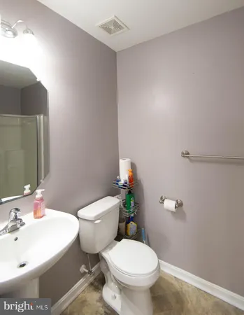 a view of a room with wooden floor and cabinet