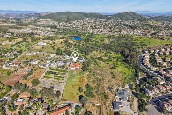 an aerial view of residential house and mountains