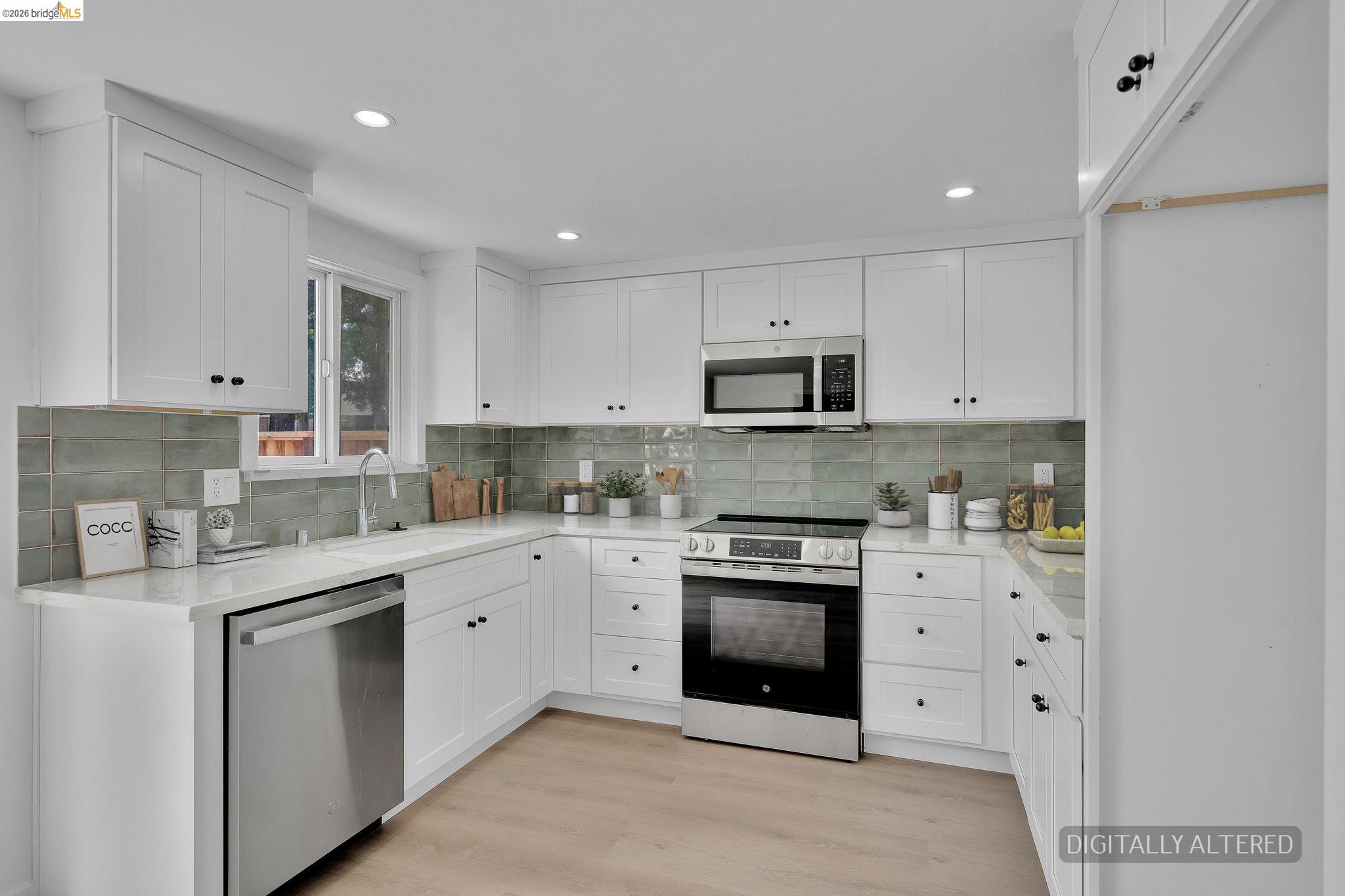 1808 Wildbrook Court, Unit D Concord, CA 94521 - Photo 14 of 47 a kitchen with cabinets stainless steel appliances and a sink
