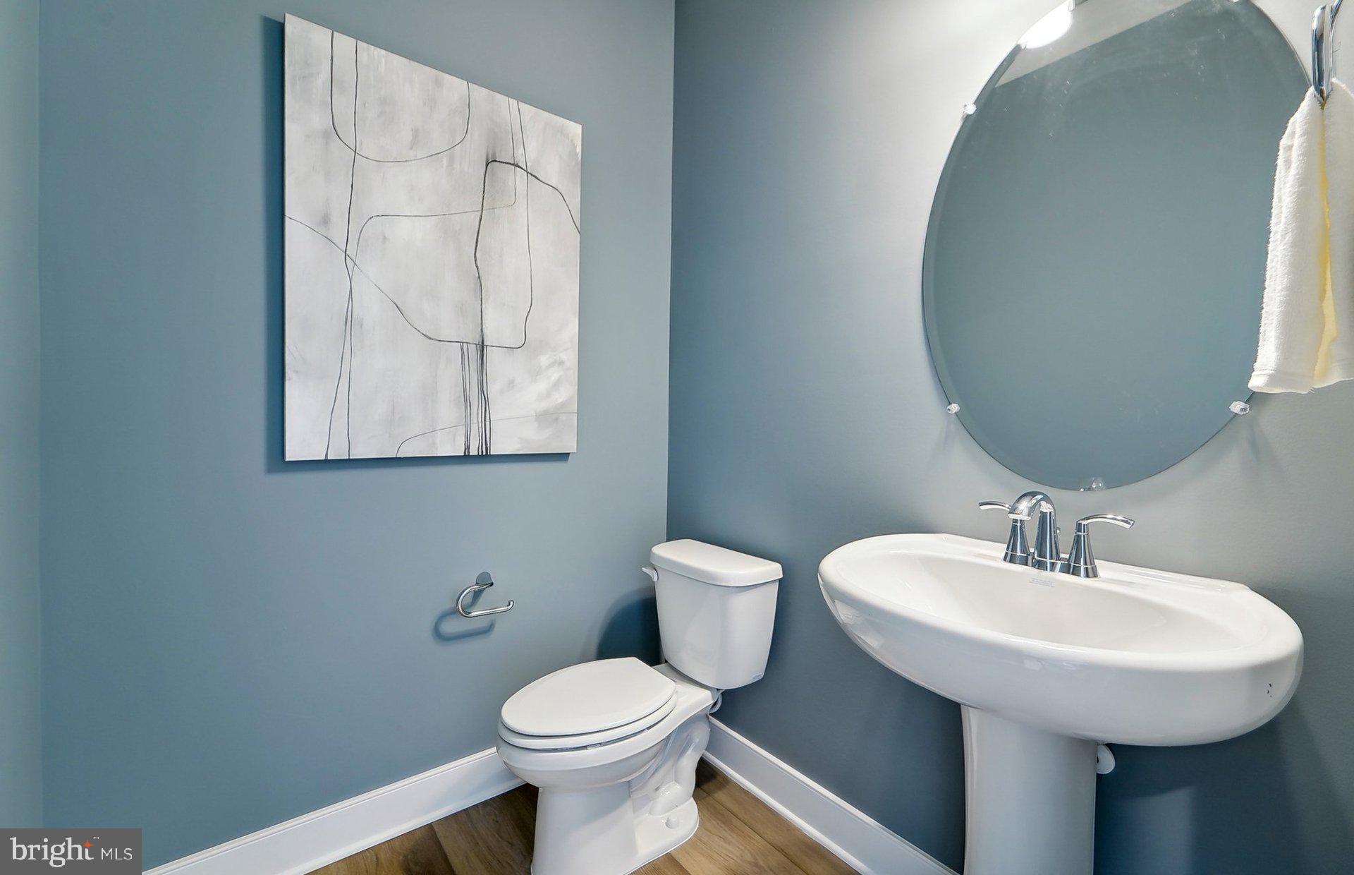 22521 Sculpin Brk Road Boyds, MD 20841 - Photo 15 of 52 a bathroom with a toilet sink and mirror