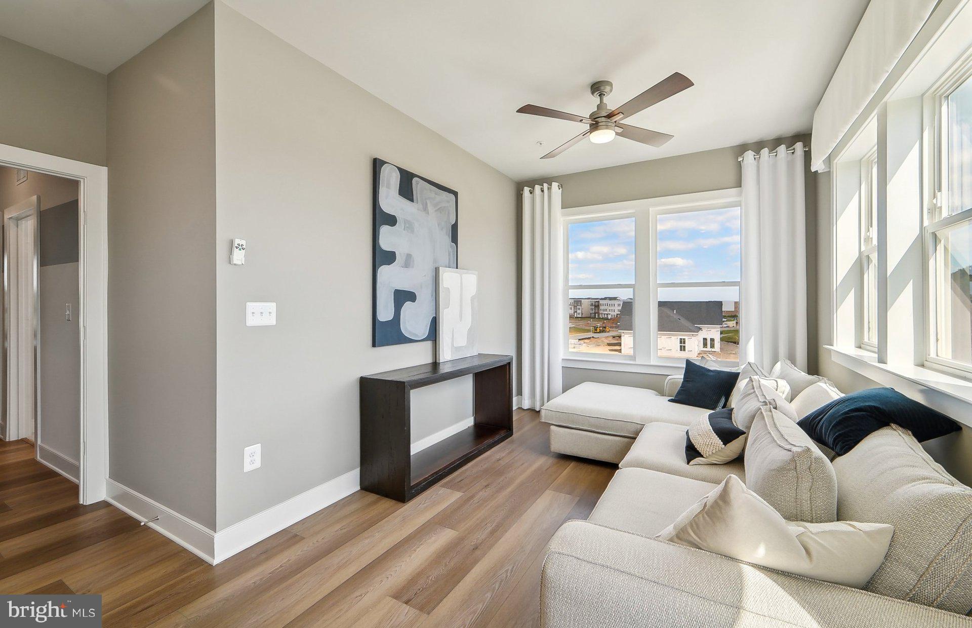 22521 Sculpin Brk Road Boyds, MD 20841 - Photo 23 of 52 a living room with furniture and a large window