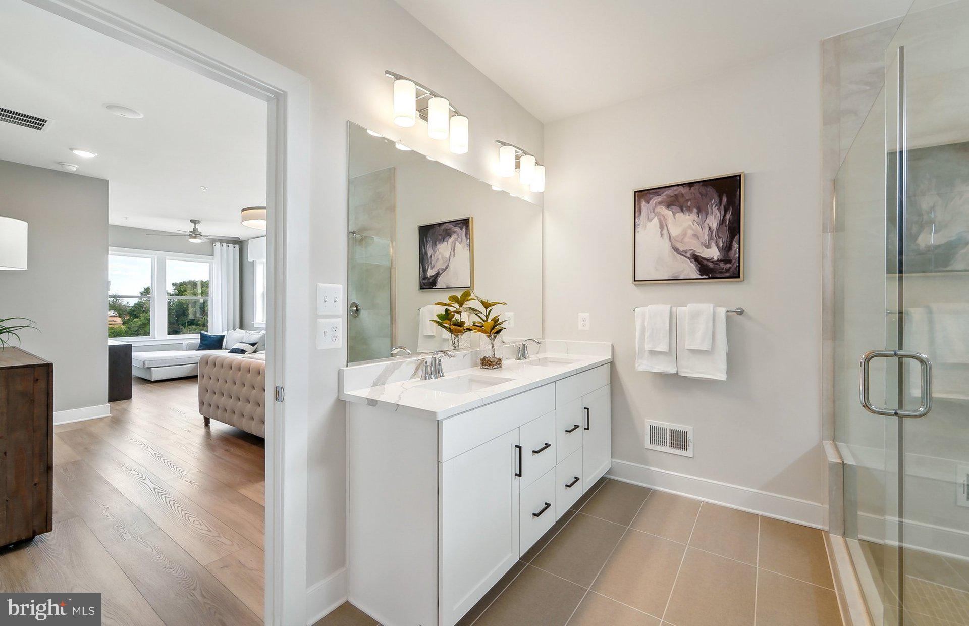 22521 Sculpin Brk Road Boyds, MD 20841 - Photo 25 of 52 a en suite bathroom with a double vanity sink a mirror and a shower