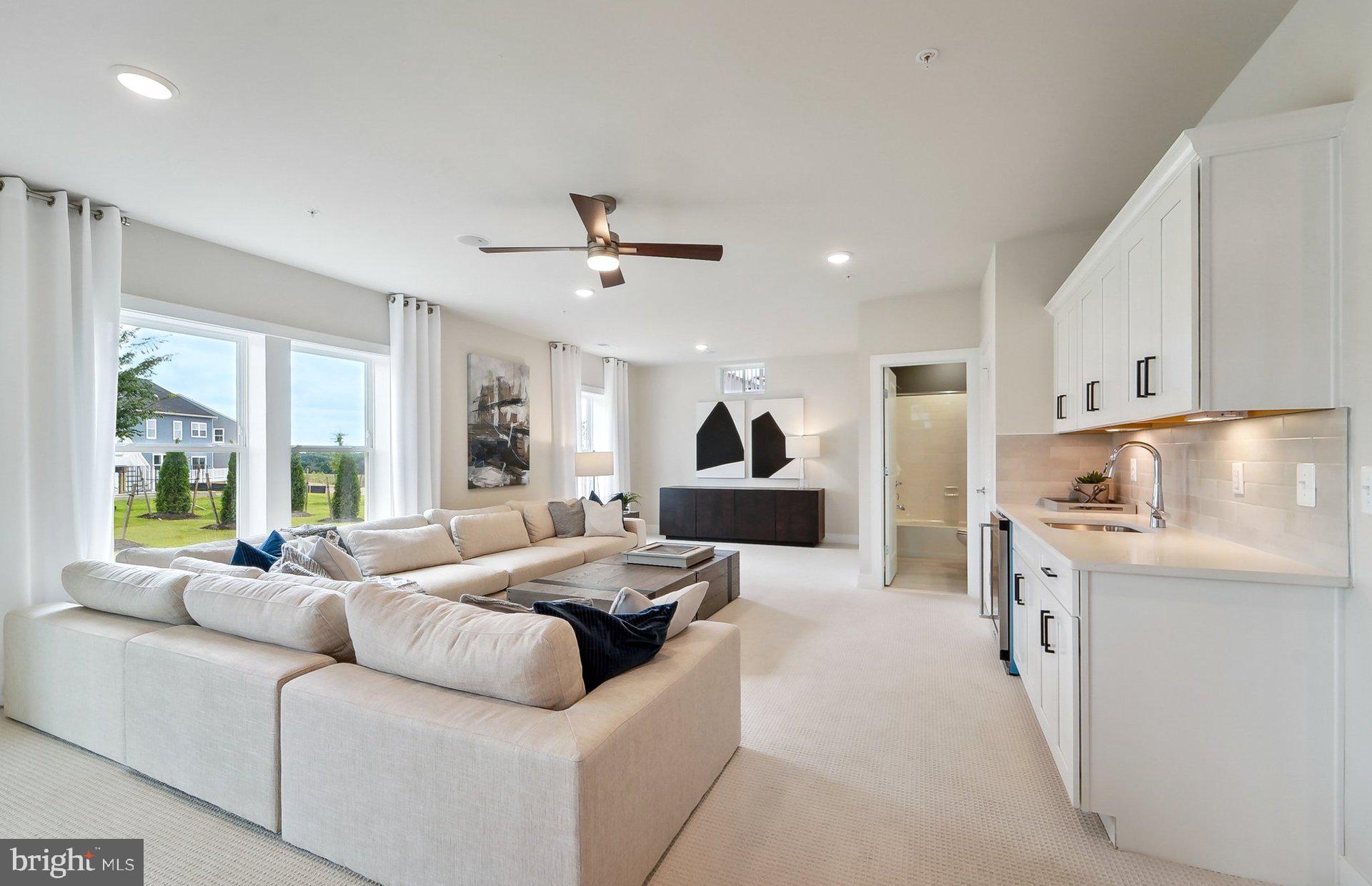 22521 Sculpin Brk Road Boyds, MD 20841 - Photo 35 of 52 a living room with furniture and a large window