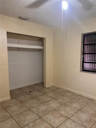 a view of a room that has a window in it