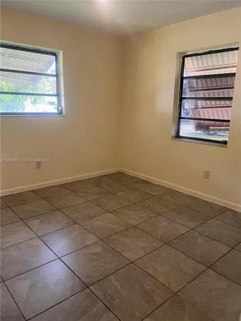 a white toilet sitting next to a bathroom