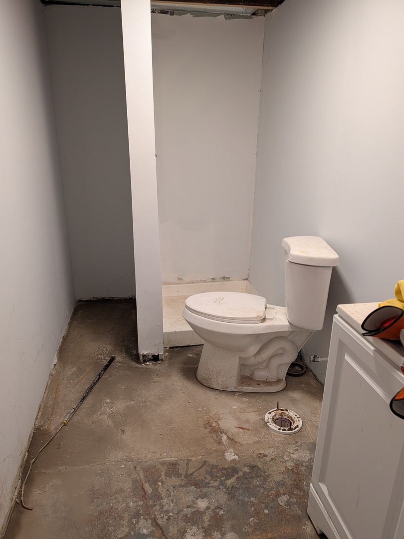 5041 West George Street Chicago, IL 60641 - Photo 11 of 11 a bathroom with a toilet and a sink