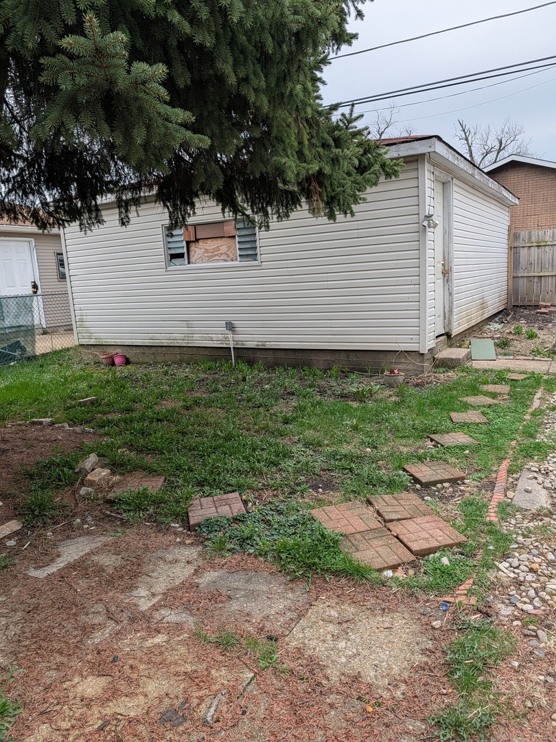 5041 West George Street Chicago, IL 60641 - Photo 3 of 11 a view of a backyard with plants and large tree